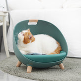 LUXENEST HOME Four Seasons Cat Nest Pet Bed with a cat relaxing comfortably in a modern pet bed.