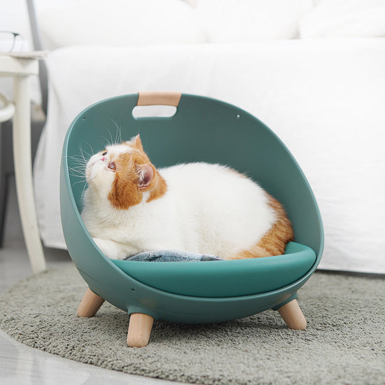 LUXENEST HOME Four Seasons Cat Nest Pet Bed with a cat relaxing comfortably in a modern pet bed.