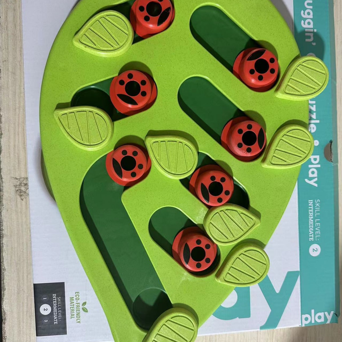 LUXENEST HOME Christmas Pet Bowl design featuring a green puzzle feeder with red ladybug paw prints.