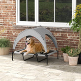 LUXENEST HOME Elevated Dog Bed with Canopy providing shade and comfort for a happy golden retriever outdoors.